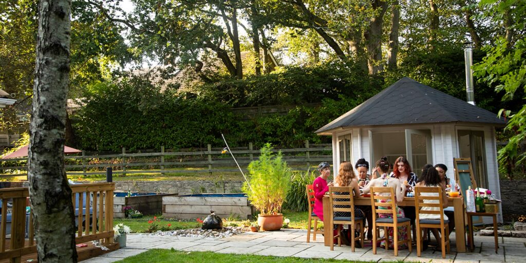 Sober Travel in Massachusetts: A gathering of women at a garden party