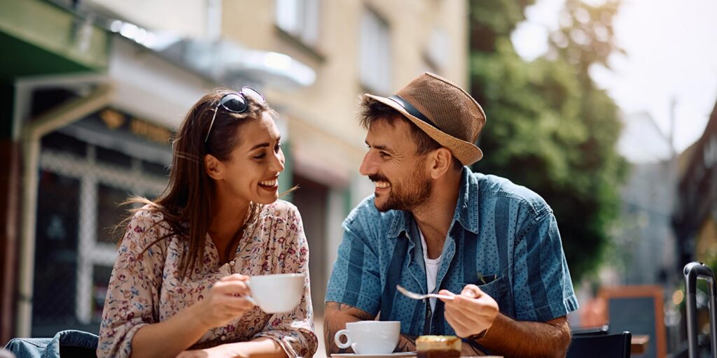Sober Date Ideas in Massachusetts: Two people enjoying a meal and coffee together.