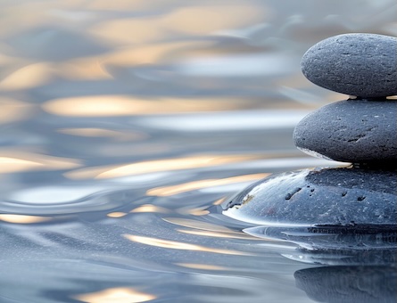 Three rocks stacked in water