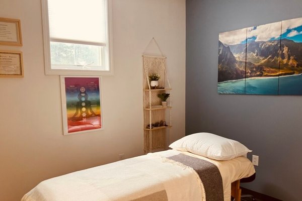 Patient Table with imagery on the walls New Wave Recovery